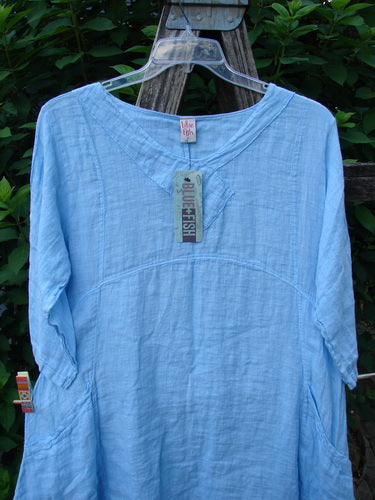 Barclay NWT Linen Cross Over Urchin Pocket Dress Unpainted Splash Size 1 displayed on a hanger, featuring a cross-over V neckline, drop shoulders, and unique side lengths, embodying Bluefishfinder.com's vintage style.
