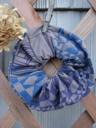 Barclay PMU Cotton & Lycra Hair Scrunchie Diamond Grid Brum Extra Large displayed on a wooden fence, showcasing its ruffled fabric and elastic band, part of Bluefishfinder.com's sustainable vintage collection.