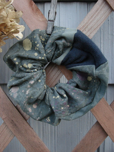 Barclay PMU Cotton Lycra & Thermal Hair Scrunchie Rain Pond Green Extra Large, ruffled fabric detail shown, hanging on a wooden fence with a clothespin.