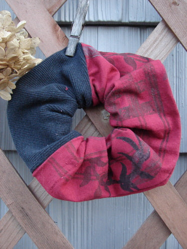 Barclay PMU Thermal Rib & Cotton Hair Scrunchie Vine Grid Black Red Extra Large, featuring a ruffled texture with thin elastic, showcased on a wooden fence, embodying vintage-inspired sustainable fashion from Bluefishfinder.com.