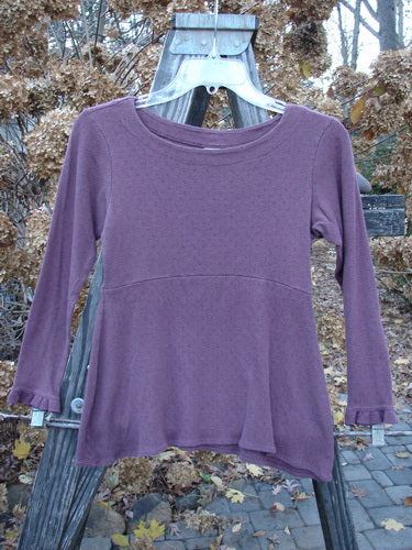 2000 Wool Pointelle Anais Top Unpainted Murple Tiny Size 0: A soft, cozy, and warm purple shirt with lettuce edging, empire waist seam, and narrow lower sleeves.