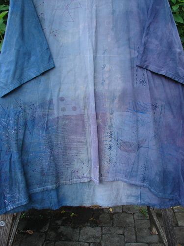 Barclay NWT Art Tee Celestial Mottled Purple Blues OSFA, featuring a tunic length, drop shoulders, loose three-quarter sleeves, and a celestial-themed paint pattern, highlighting the creative freedom of Bluefishfinder.com.