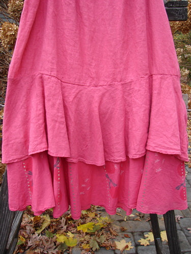 A Barclay Linen Two Tier Ruffle Skirt in Peony, size 2. Features a medium weight linen upper layer and a painted batiste layer with a tiny dragonfly theme. Perfect condition. Waist: 38" to 48", Hips: 58", Hem Circumference: 90". Upper Linen Length: 27", Lower Batiste Length: 34".