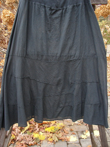 Barclay Batiste Fold Over Wave Layer Skirt, black, size 2, on a stand.