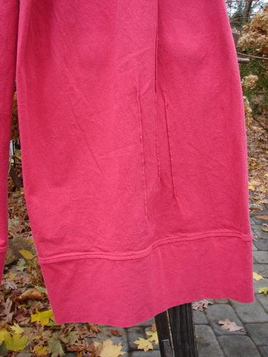 A pink dress on a pole with a close-up of a chair, Barclay Heavy Weight Denim Crop Tool Pant Unpainted Tulip Size 2.
