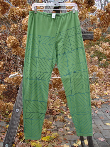 A slim-fitting Barclay Cotton Lycra legging with a unique pattern, resembling a pine forest. Size 2.