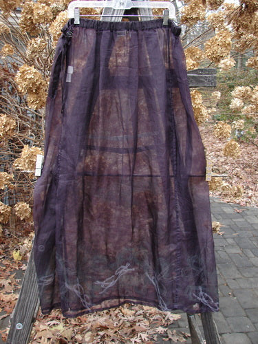 2000 Silk Organza Skirt with Celtic Knot Pattern, Aubergine, Size 2: A sheer purple skirt with a flare, featuring vertical panels and graceful movement.