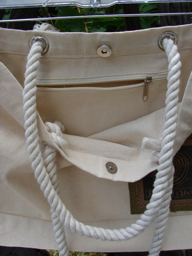 1998 PMU Patched Canvas Rope Tote Bag Hydrangea Leaf Natural OSFA, featuring heavy-weight cotton canvas, white rope shoulder straps, interior snap, interior pocket, and signature Blue Fish Patch, displayed in close-up.