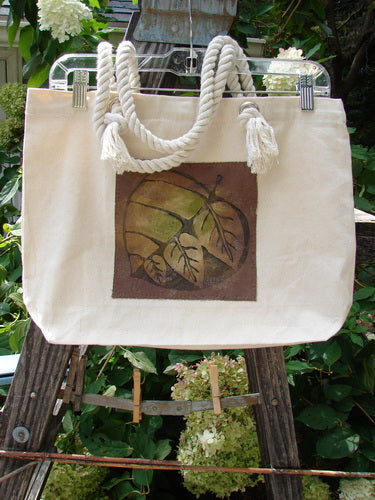 1998 PMU Patched Canvas Rope Tote Bag Hydrangea Leaf Natural OSFA, featuring a brown design on heavy-weight cotton canvas with rope shoulder straps and a top opening with an interior snap.