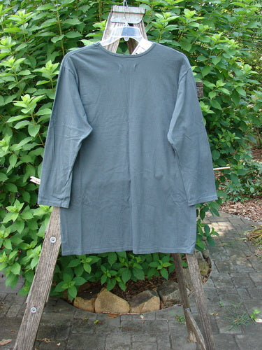 Barclay NWT Long Sleeved Studio Tee displayed on a wooden rack, showcasing its straight shape, cozy sleeves, and rounded neckline, featuring the classic Blue Fish Love theme, perfectly embodying Bluefishfinder.com's vintage aesthetic.