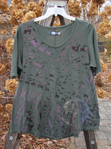 Barclay Short Sleeved Textured A Lined Tee with Primitive Herd design on a green shirt.