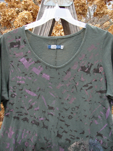 Barclay Short Sleeved Textured A Lined Tee with purple designs on it, made from light weight cotton. Features include an oval neckline, rounded hemline, and a flowing fabric with primitive herd theme paint and golden accents. Size 0.