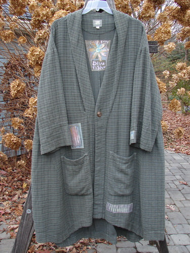 2001 Patched Toy Box Jacket in Kelp, Size 1: Long grey coat with raised cording patterns, vintage button closure, oversized front pockets, and colorful patches.
