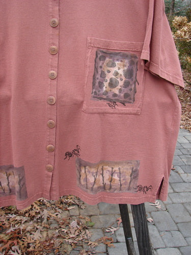 1994 Camp Shirt Tiny Ant Gourd Size 2: A pink shirt with a spider design, featuring a varying hemline, wider neckline, oversized breast pocket, and vented sides. Made from 100% cotton.