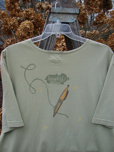2001 Short Sleeved Tee Glider Plane Kelp Size 1: A shirt with a glider plane theme painted on it, perfect condition.