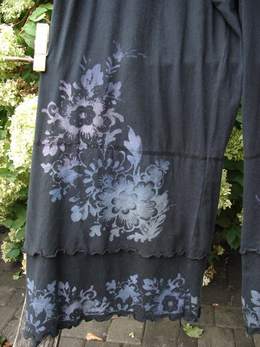 Barclay Cotton Lycra Crop Double Ruffle Pantaloon Pant Floral Black Size 1 in black cotton lycra, with pale floral prints and scalloped double ruffle hems. The cropped pant legs fall in soft, loose folds, and the layered lower edge creates a textured, airy silhouette.