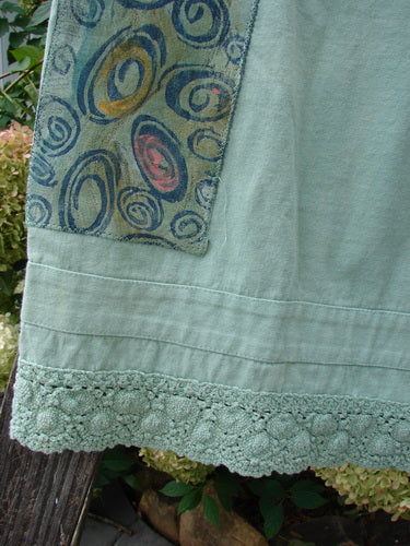 Close-up of the 1992 PMU Patched Pantaloon Continuous Spin Cucumber OSFA, showcasing intricate antique lace, drawcord waistline, and signature Blue Fish patch detailing.