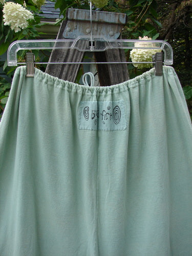 1992 PMU Patched Pantaloon Continuous Spin Cucumber OSFA displayed on a hanger, featuring a full drawcord waistline, wide swingy lowers, antique lace trims, and signature patches.