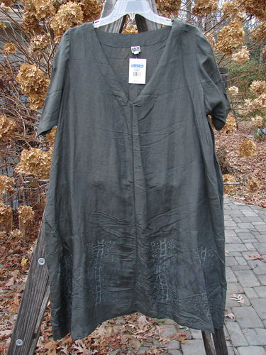 2000 NWT Hemp Silk V Over Top Biology Domino Size 1: A loose-fitting, V-neck tunic dress with a flowy A-line shape, showcasing a suggestive biology-themed design and sectional bodice, hanging outdoors.