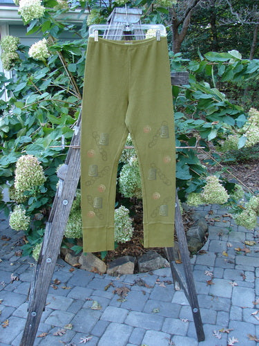 2000 Thermal Layering Lu Pant Soft Geo Greenroot Size 1 displayed on a ladder, featuring chains and a professionally replaced elastic waistband, highlighting its unique design and vintage Blue Fish Clothing style.