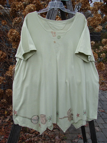 1994 Leaf Top Music Garden Aloe Size 2: A green shirt with a design on it, featuring a unique painted 4 point hemline and a super big tailored swing.