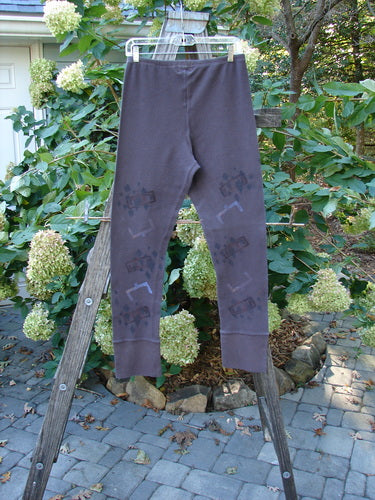 2000 Thermal Layering Lu Pant Soft Geo Brum Size 1, displayed on a wooden ladder, features professionally replaced elastic waistband and nifty ribbed lowers, showcasing its vintage Blue Fish Clothing style.