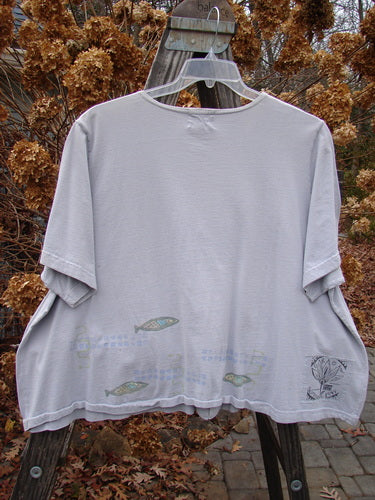 1999 Tiny Pocket Top Fish Water Size 2: Grey t-shirt on a swinger with fish drawings. A swingy cropped A-line shape with two tiny oval bottom pockets.
