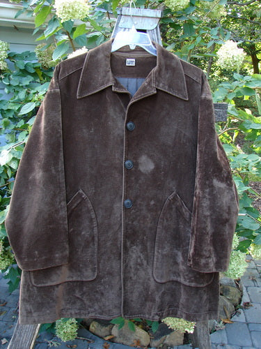 1999 Limited Edition Shed Jacket Unpainted Deepest Brown Size 1 displayed hanging outdoors, showcasing its plush fabric, rubberized buttons, oversized pockets, and A-line shape, reflecting Bluefishfinder.com's vintage style.