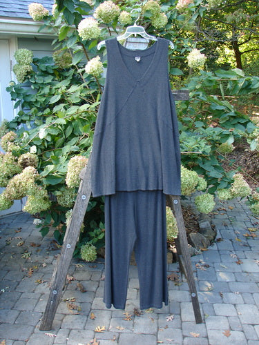 2000 Rayon Lycra Rib Crossroad Road Flare Duo in Unpainted Charcoal Heather Size 2 displayed on a wooden ladder, showcasing its draped A-line shape and flare pant with elastic waist.