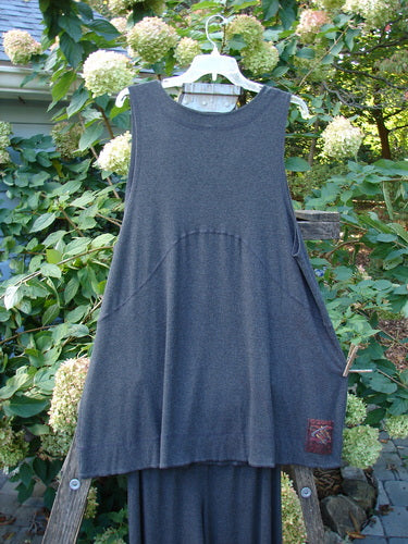 2000 Rayon Lycra Rib Crossroad Road Flare Duo, featuring a vest and pants, hangs on a clothesline, showcasing its A-line shape and flare design from BlueFishFinder.com.