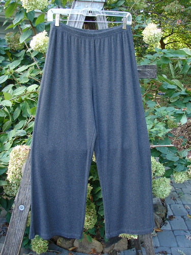 2000 Rayon Lycra Rib Crossroad Road Flare Duo Unpainted Charcoal Heather Size 2 displayed hanging, showcasing the pants' full elastic waistline and slightly flared bottom, emphasizing its superior drape and fall.