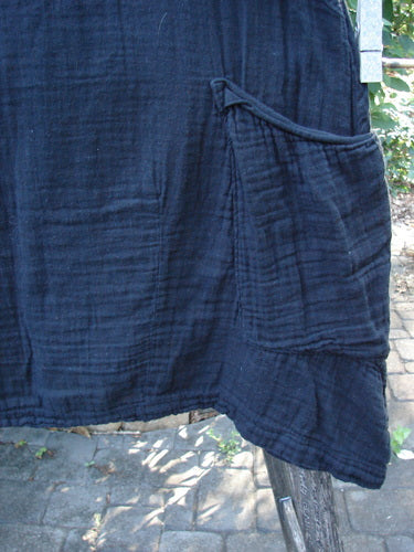 Barclay NWT Gauze Seaside Tunic Dress Unpainted Black Size 0 features a varying hemline, scooped flutter neckline, and wide short sleeves, highlighting its lightweight cotton gauze material and unique design elements.