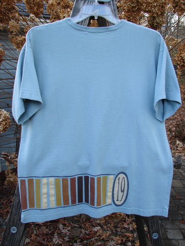 1998 Short Sleeved Tee Number 19 Pool Size 1: Blue t-shirt with number design, drop shoulders, ribbed neckline, and made from organic cotton.