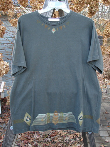 1998 Short Sleeved Tee Diamond Game Domino Size 1: A grey t-shirt with a design on it. Made from 100% Mid Weight Organic Cotton. Features a thinner ribbed neckline and a signature Games Patch. Bust 50, Waist 50, Hips 50, Length 30.