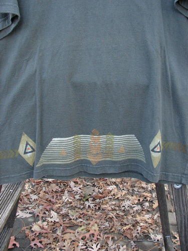 1998 Short Sleeved Tee Diamond Game Domino Size 1: A grey shirt with a design on it, featuring a close-up of leaves on the ground.