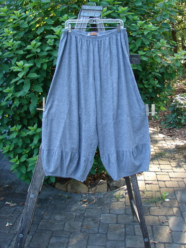 Barclay Hemp Cotton Meadow Pant Unpainted Indigo Stripe Size 1 displayed on a ladder, showcasing its full elastic waist, bellowing mid sections, and slightly cropped length with gathered horizontal panels.