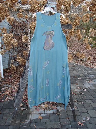 1993 Journey Jumper Vase and Heart Ocean Size 1: A blue dress on a rack with a drawing and white design on it.