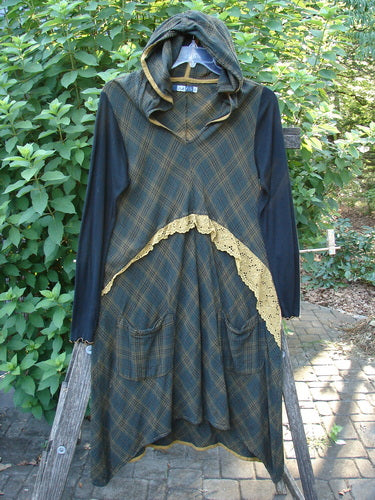Barclay Rayon Linen Ruffle Pocket Dress Brown Plaid Tiny Size 0 features a hi-low hemline and long ribbed sleeves, captured close-up, showcasing its lace accents, gold piping, and distinctive exterior pockets.