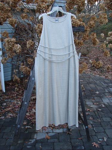 1998 Linen Knit Wrap Dress Unpainted Natural Size 2: A white dress with a flowing linen knit fabric, featuring a rounded rolled neckline and a continuous bodice wrap with cord keepers. Drapes long and slender with grace and elegance.