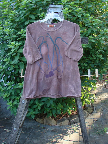 Barclay Cotton Lycra Three Quarter Sleeved A Line Tee Roots Mottled Clay Size 1 displayed on a swinger, showcasing its rounded neckline, curly edgings, and A-line shape, reflecting vintage-inspired elegance.