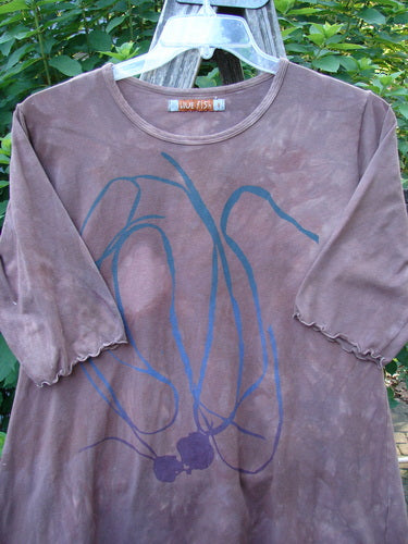 Barclay Cotton Lycra Three Quarter Sleeved A Line Tee Roots Mottled Clay Size 1 features a rolled neckline and curly edgings, showcasing its unique style in a close-up detail.