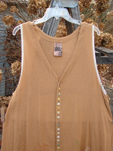Image alt text: 1998 Gauze Shell Vest Angel Wing Cork Size 2: Brown dress with square shell buttons, rounded hemline, hand-dyed silk ribbon edges, A-line shape, and deeper arm openings.