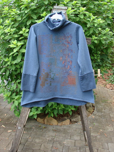 Barclay Fleece Mock Collar Pullover Sweatshirt Metallic Wheat Deep Tealen Size 0, showcasing a cozy cowl collar and wide sleeves, displayed on a rack, highlighting its unique Celtic moss detailing.