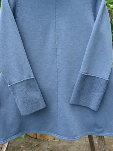 Barclay Fleece Mock Collar Pullover Sweatshirt Metallic Wheat Deep Tealen Size 0, featuring a flop Celtic moss cowl collar and metallic wheat theme art, showcased in a close-up of its smooth outer fabric.