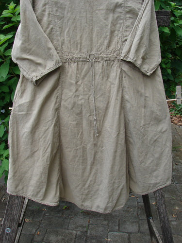 Barclay Batiste Bliss Dress Fallen Petal Stonetail Size 0 showcases a soft rounded neckline, short sleeves, exterior flop pockets, and a drawcord back, featuring the Falling Petal theme on organic cotton batiste.