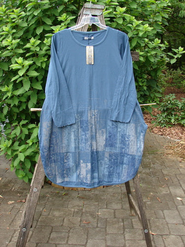 Barclay NWT Natalia Round Bottom Tunic, City Floral Echo Blue, Size 0, displayed on a rack showcasing its elegant sleeves and floral pattern, embodying the vintage style of Blue Fish Clothing.