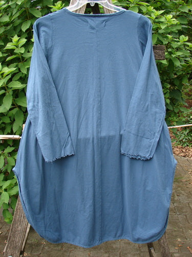 Barclay NWT Natalia Round Bottom Tunic City Floral Echo Blue Size 0, featuring a flowing silhouette with intricate floral patterns, displayed on a clothes rack, embodying Bluefishfinder.com's vintage charm and unique fashion expression.