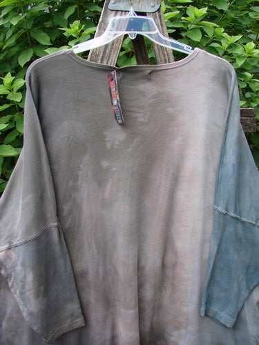 Barclay NWT Patched Supima Taos Mountain Tunic Belief Spirit Magic Peace Grey OSFA, featuring a close-up of a grey, creatively designed tunic, showcasing intricate patchwork, emphasizing individuality and artistic expression.