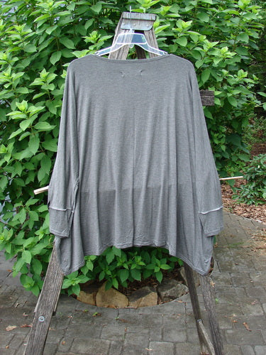 Barclay NWT Rayon Spandex Mariposa Square Top 1923 Tree Grey OSFA displayed on a clothes rack, showcasing its elegant drape and unique design, reflecting BlueFishFinder.com's commitment to creative, vintage-inspired fashion.