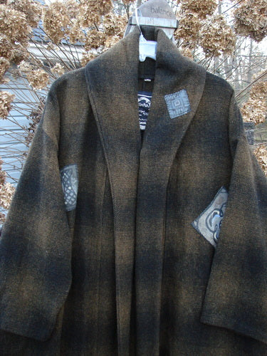 1995 Patched Theater Coat Music Man Cottage Brown Plaid OSFA: Oversized A-line coat with vintage button closure, double-layered fold over collar, deep side pockets, and unique patches. Perfect condition, made from soft brushed wool. A cozy, winter treasure!